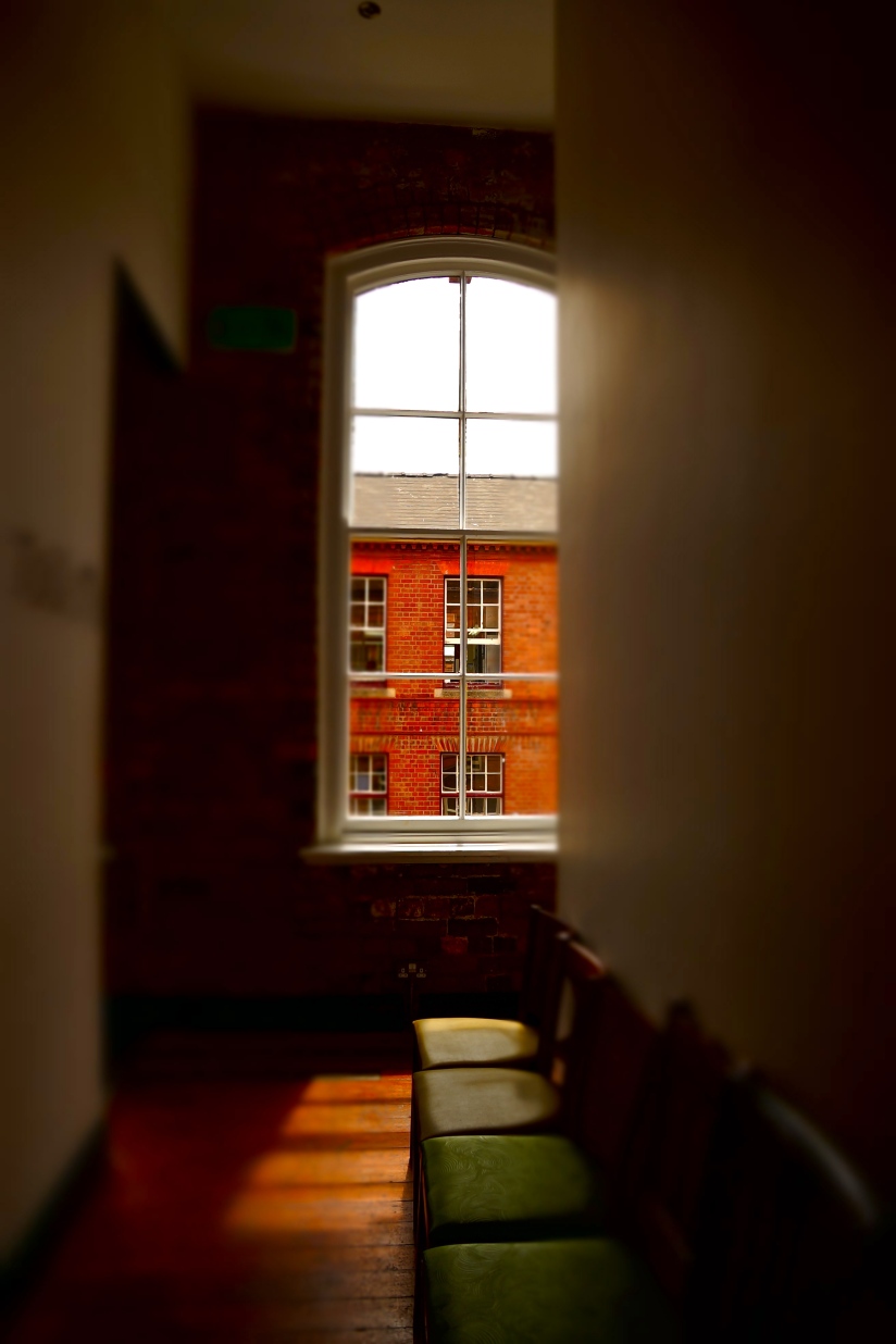View across to the Victorian Birmingham red brick building of the Jewellery Quarter from Vertu Bar. . . 