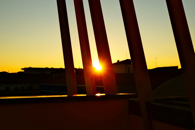 The last glimpse of sunlight between the beams of the lonely terrace in Vicenza. . . 